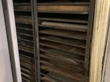 many trays of food that are sitting on a rack