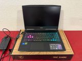 a laptop computer sitting on top of a box on a table