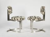 a pair of chairs with a black and white design on them