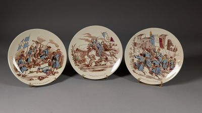 three brown and white plates with pictures of people on them