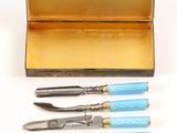 four different types of tools in a case on a white surface