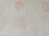 four stamps on a piece of paper on a table