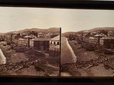 an old photo of a view of a town from the top of a hill