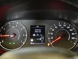 a close up of a car dashboard with a speedometer and gauges