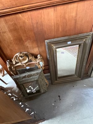 a mirror on the floor next to a mirror on the wall