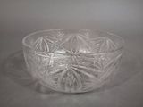 a glass bowl that is sitting on a table
