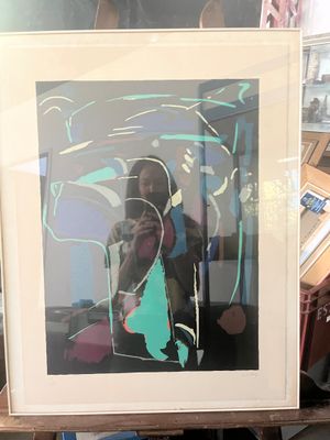 a picture of a woman taking a picture of herself in a mirror