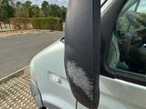 a white van that is parked on the side of the road