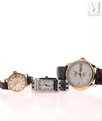 three different types of watches on a white surface with a white background