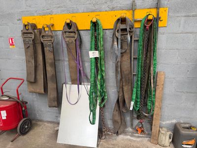 many tools hanging on the wall in the garage
