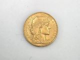a gold coin with a woman ' s head on it