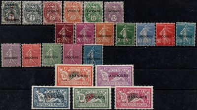 several different colored stamps are arranged on a black surface