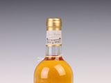 an image of a bottle of alcohol sitting on top of a table