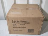 boxed box on a table in front of a white wall