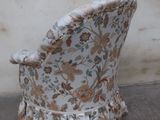 a chair that is sitting in front of a wall