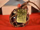 a bottle of wine that is wrapped in a rope