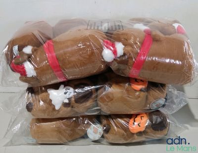 a bunch of stuffed animals wrapped in plastic bags