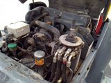 a small engine in the back of a truck