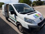 a white van that has a rainbow sticker on the side of it