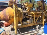 a yellow machine that is sitting on the side of the road