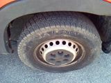 a close up of a flat tire on a truck