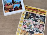 two comics are sitting on a table next to each other