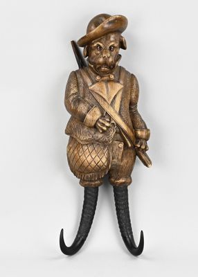 figurine en bronze représentant un homme portant un chapeau et une canne
