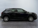 a picture of a black suv parked in a garage