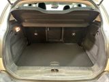a trunk of a car with the back door open