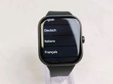 a smart watch sitting on top of a clear stand