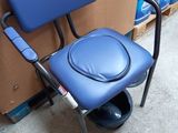 a blue chair that has a seat on it