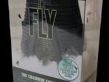 a box with a picture of the fly on it