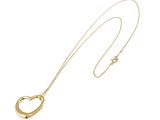 a close up of a gold heart shaped necklace on a white background