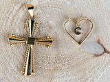two gold cross pendants with a heart and a letter c