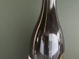 a bottle of wine that is sitting on top of a box