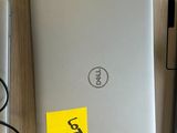 two laptops that are sitting on a table