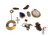 many different types of jewelry on display on a white surface