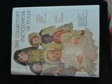a book with a picture of a group of dolls on it