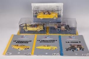 four books in a clear box on the table
