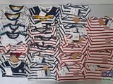 a lot of baby clothes that are on a table