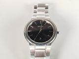an image of a close up of a wrist watch on a white surface