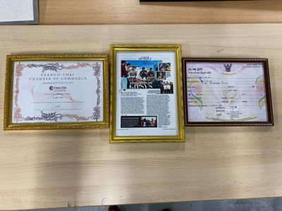 three framed pictures on the wall of a restaurant