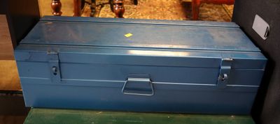 a blue tool box sitting on top of a green table