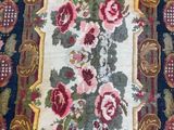 an image of a rug with flowers on it on a wooden floor