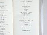 a book open to a list of items on a table