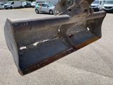 a bulldozer that is sitting in a parking lot