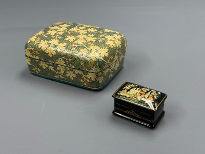 a small box and a small box sitting on a table