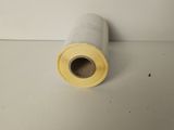 a close up of a roll of paper on a white surface