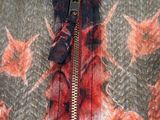 a close up of a jacket with a flower pattern on it