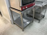 two microwaves that are sitting on top of each other
